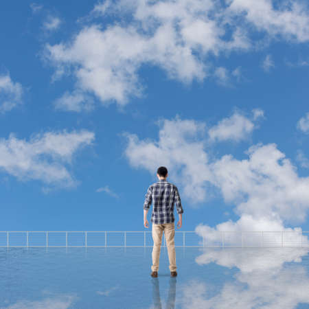 Man look and discover against the cloudy sky with copyspace.
