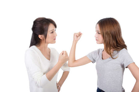 Friend arguing, two asian women.の写真素材