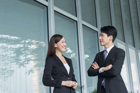 Asian business woman talk to others in the city.の写真素材