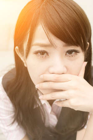Sad business woman feel worried and stressed in outside of modern city.の写真素材
