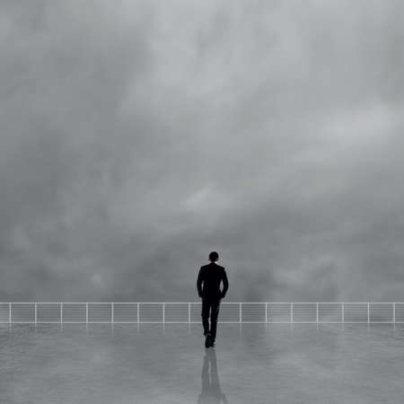 Man look and discover against the cloudy sky with copyspace.の写真素材