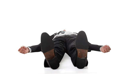 Asian businessman lying on ground, full length portrait isolated