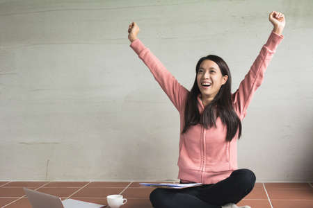 Asian woman working at home and feel freedom.の写真素材