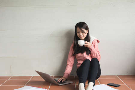 Asian woman working at home.の写真素材