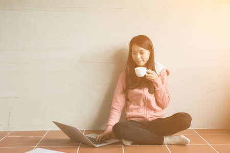 Asian woman working at home.の写真素材