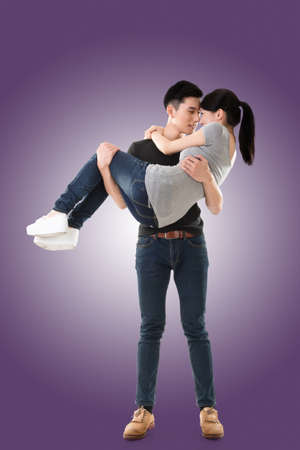 Attractive young Asian couple, full length portrait isolated.の写真素材
