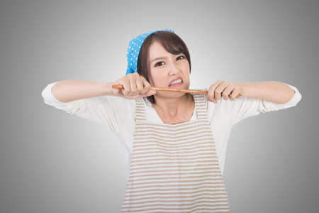 Mad Asian housewife, closeup portrait.の写真素材