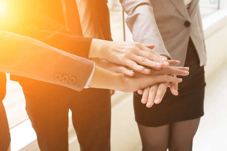 Group of business people joining hand together for making a dealの写真素材