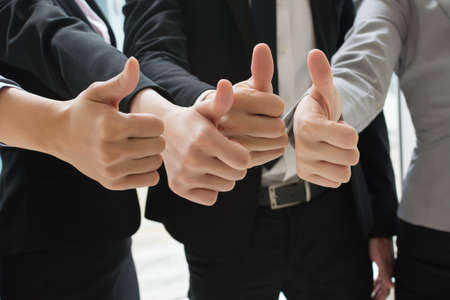 Group of business people showing thumb up gestureの写真素材