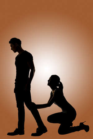 Silhouette of Asian couple begged another one not to leave, full length portrait isolateの写真素材