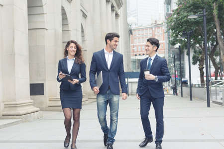 Group of business people walking at streetの写真素材