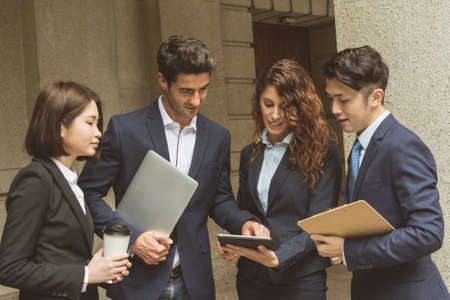 Business people working outside office