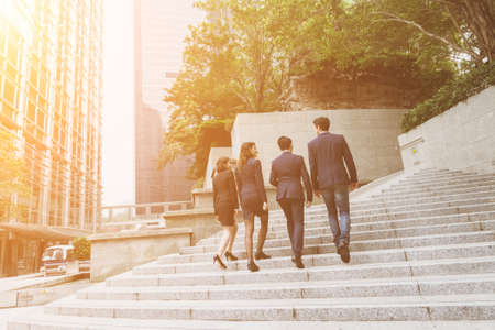 Group of business people walking at street