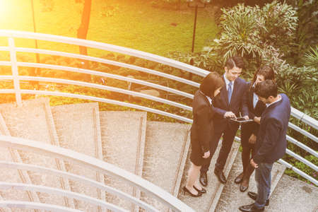 Group of business people discuss at outdoor