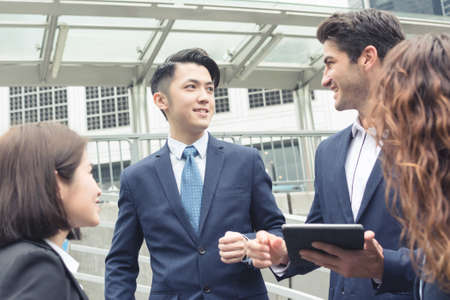 Business people working outside office