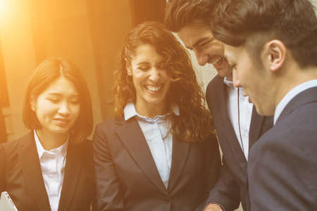 Business people working outside officeの写真素材