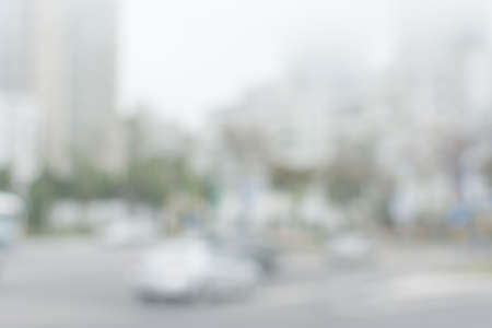 Abstract urban background with blurred buildings and street, shallow depth of focus.の写真素材
