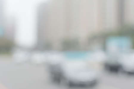 Abstract urban background with blurred buildings and street, shallow depth of focus.の写真素材