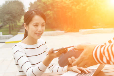 Woman pay on pos machineの写真素材