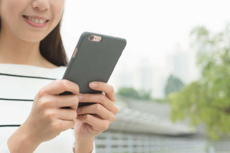 Asian Woman use of cellphone