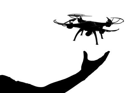 silhouette of drone against white backgrounの写真素材