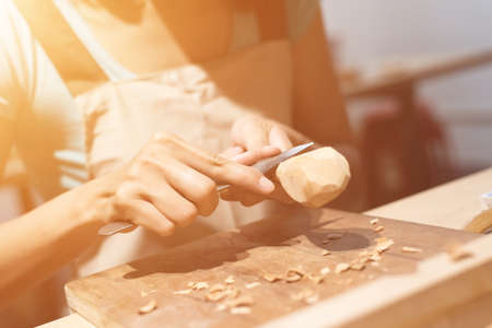 woman carpentry at home, wooden work conceptの写真素材