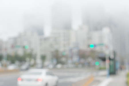 Abstract urban background with blurred buildings and street, shallow depth of focus.の写真素材