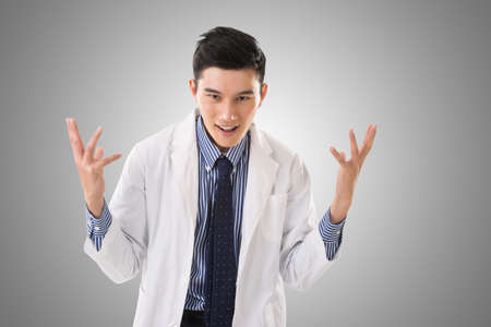 crazy Asian doctor, closeup portrait.の写真素材