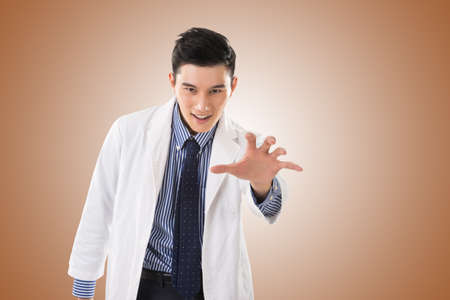 crazy Asian doctor, closeup portrait.の写真素材