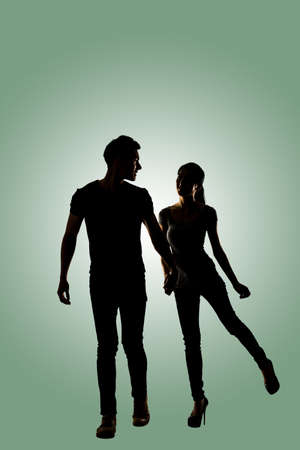 Silhouette of young Asian couple, full length portrait isolated.の写真素材