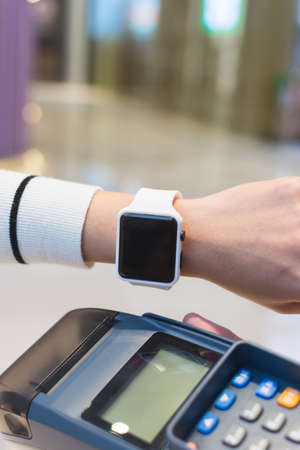 Customer pay by smart watch by NFCの写真素材