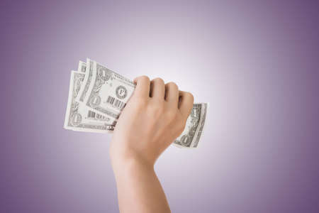 woman hand holding one dollar billの写真素材