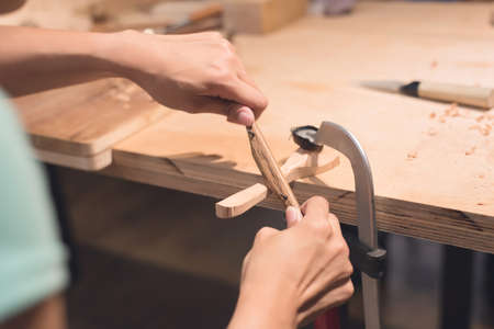 woman carpentry at home, wooden work conceptの写真素材