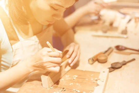 woman carpentry at home, wooden work conceptの写真素材