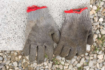 Dirty gloves in the outdoor with nobody.