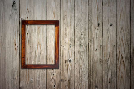 old wooden picture frame on wallの写真素材