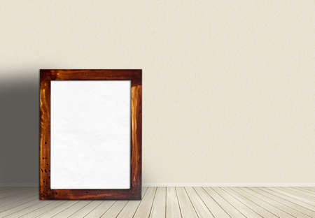 old wooden picture frame on wallの写真素材