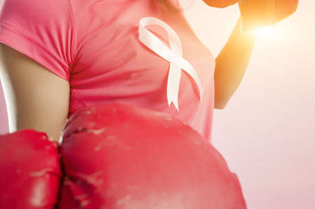Woman fight. Pink ribbon in support of October, breast cancer awareness month.の写真素材