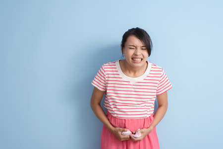 pregnant asian woman with labor painの写真素材