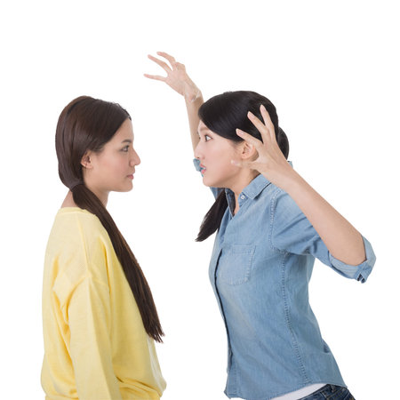 Unhappy Asian woman with her friend, closeup.