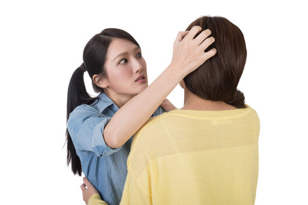 Unhappy Asian woman with her friend, closeup.の写真素材