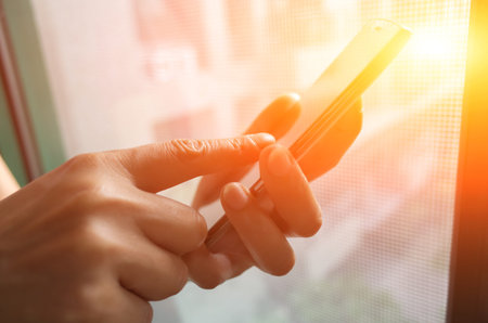 Closeup portrait of Asian woman using smartphone, concept of technology or communication.の写真素材