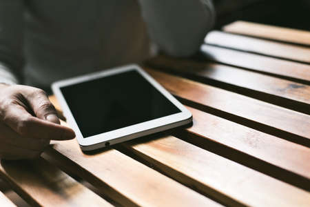 Asian woman use pad in a room, concept of technology, shopping, social community.の写真素材