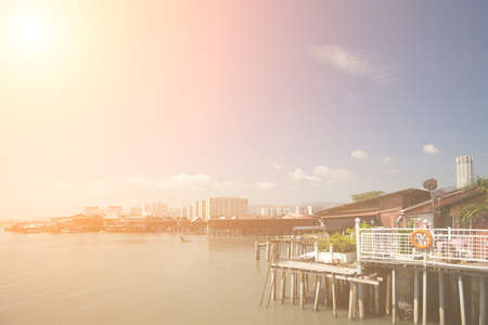 Pier near modern city with boat dwellers in Penang, Malaysia, Asia.の写真素材