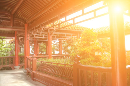 Chinese corridor in with red pillar and yellow roof, architecture interior of temple.の写真素材