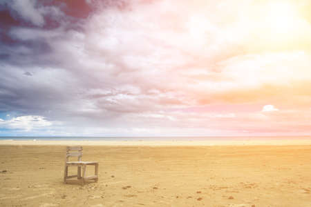 It is a lonely one chair on the beach.の写真素材