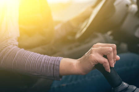 woman hands of a driver on gearbox of a car with copyspaceの写真素材