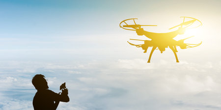 silhouette of one man use a drone flight