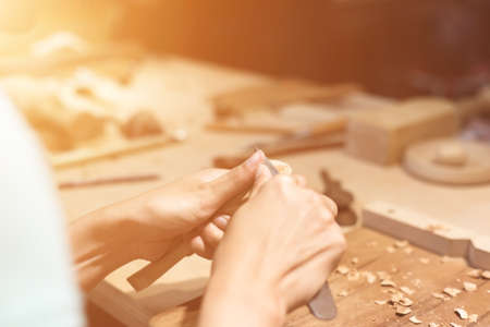 woman carpentry at home, wooden work conceptの写真素材