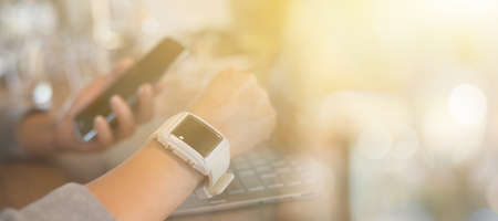 working at home by using smart watchの写真素材